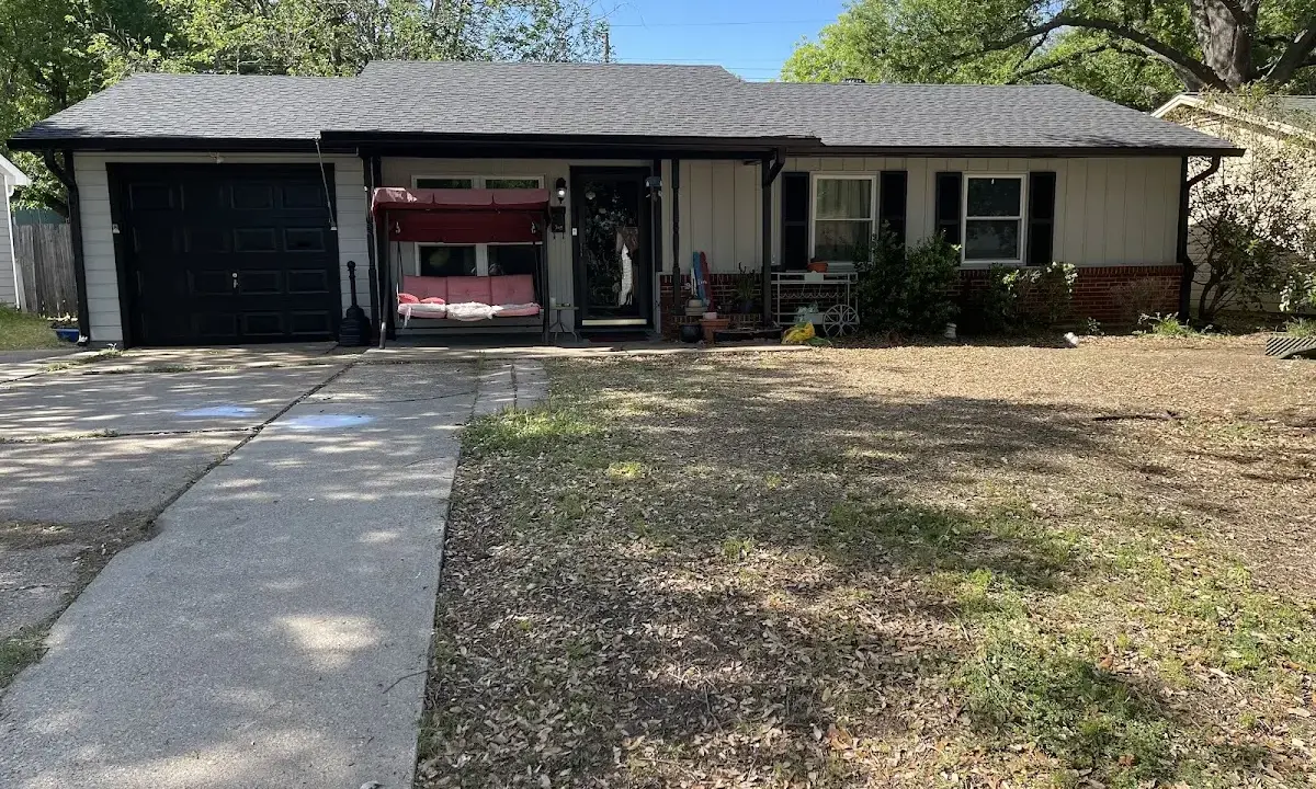 Metal Roof Installation crew at work on a residential roof in Biloxi